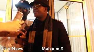 Play the Malcolm X (By Any Means Necessary) video